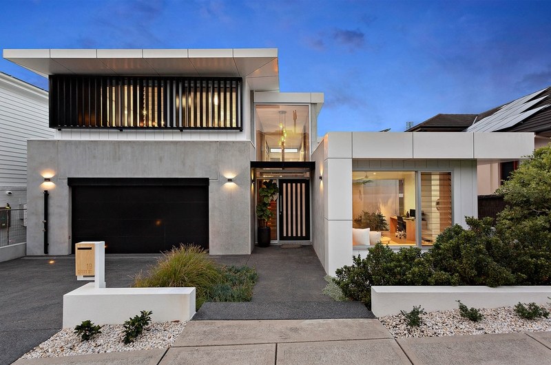 Modern two-storey Adelaide home at dusk with feature lighting